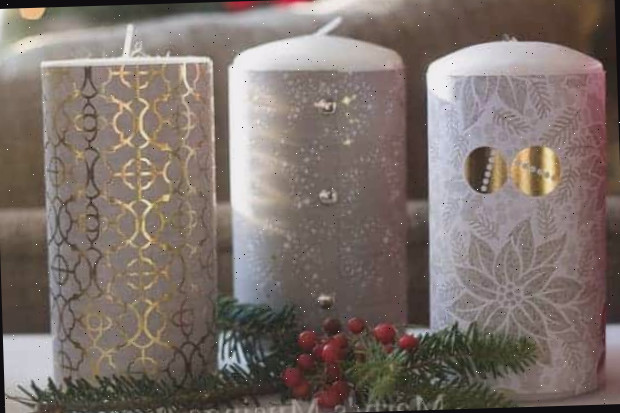Velas altas envoltas em papel scrapbook dourado