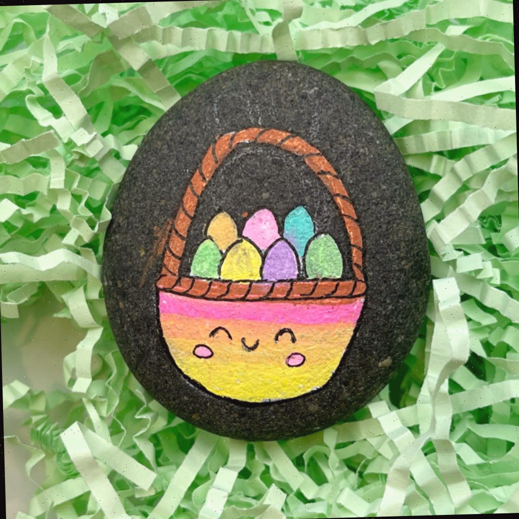 Pedra pintada de cesta da Páscoa