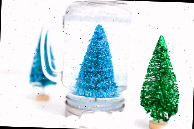 Decoração de globo de neve em recipiente de vidro
