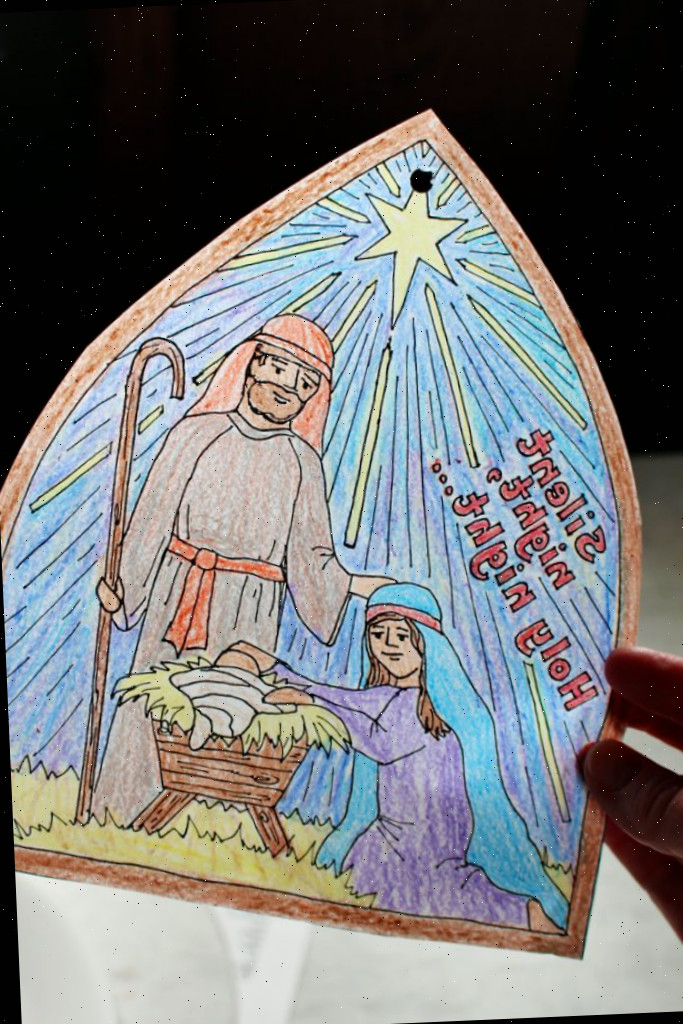 Decoração de janela da página para colorir Silent Night Christmas com luz brilhando por trás.
